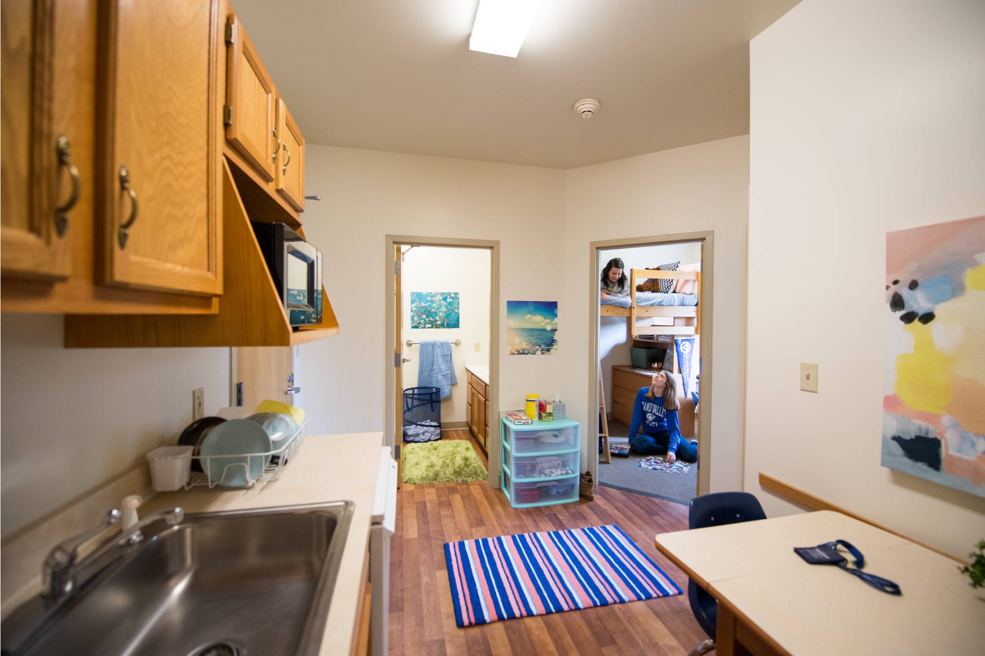 Image of students in a 2 bedroom apartment style room